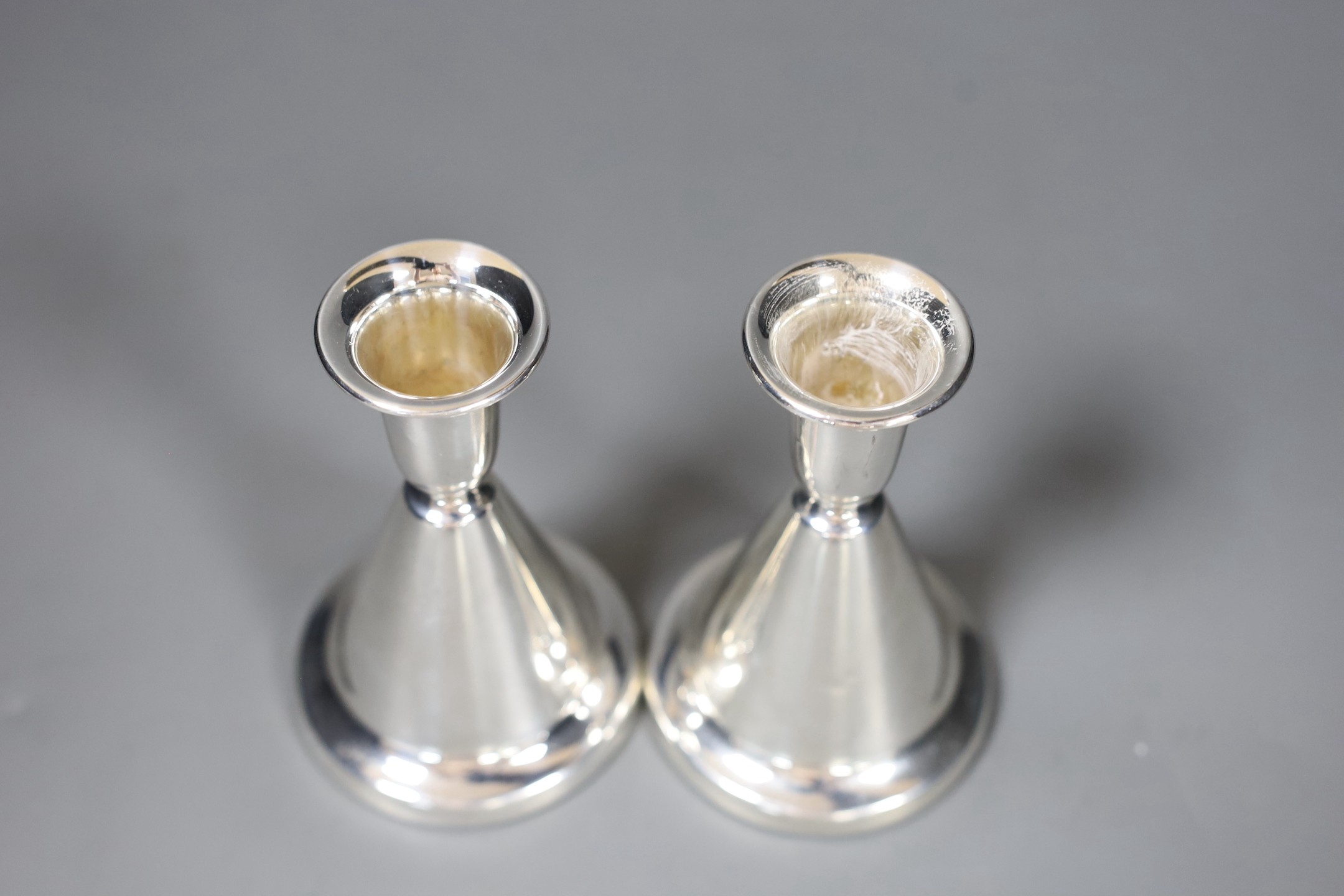 Two pairs of 20th century Scandinavian 830 standard white metal dwarf candlesticks, tallest 10.7cm.